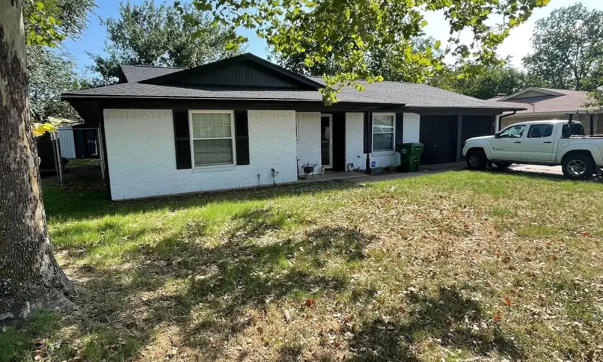 Professional roofing crew working on a residential roof in Georgetown